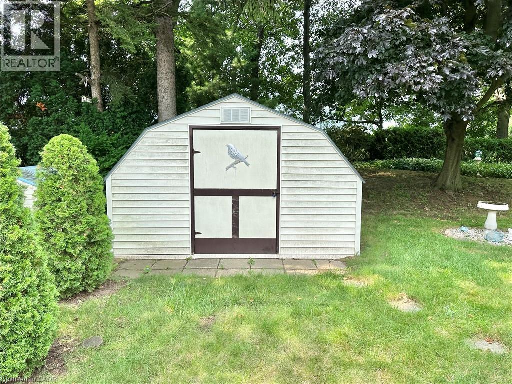 Gable-roof storage shed with horizontal siding and double doors - 44 Douglas Avenue, Simcoe, ON - Outdoor