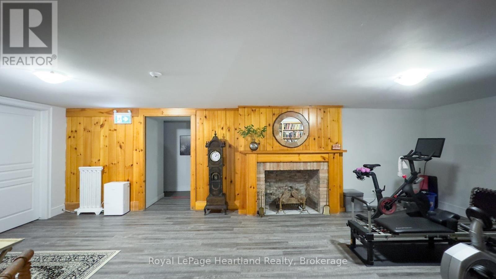 100 - 5 Cobourg Street, Goderich (Goderich (Town)), ON - Indoor Photo Showing Other Room With Fireplace