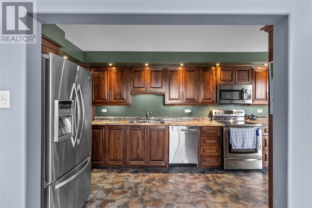 255 Corporal Jamie Murphy Drive, Conception Harbour, NL - Indoor Photo Showing Kitchen With Double Sink