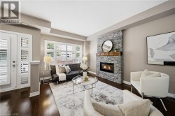 Stone-clad fireplace with a wood-finish mantel and built-in insert - 
