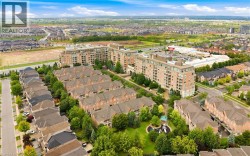 Expansive residential community featuring multi-story buildings, townhome-style residences, and dedicated green spaces - 