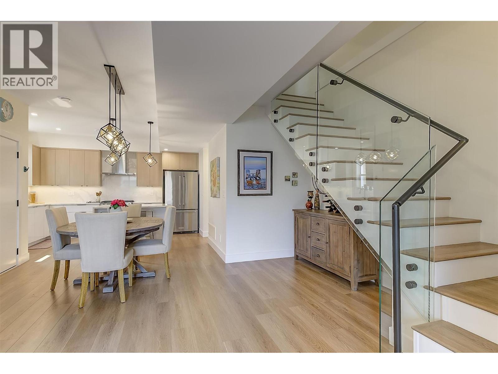 Open-concept design connects the kitchen, dining and living areas - 747 Patterson Avenue Unit# 2, Kelowna, BC - Indoor Photo Showing Dining Room