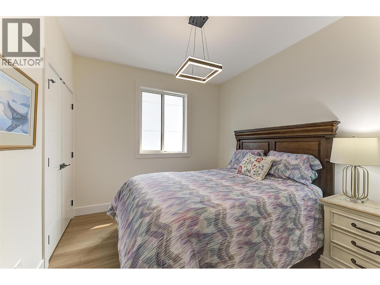 Bright upper-level bedroom - 747 Patterson Avenue Unit# 2, Kelowna, BC - Indoor Photo Showing Bedroom