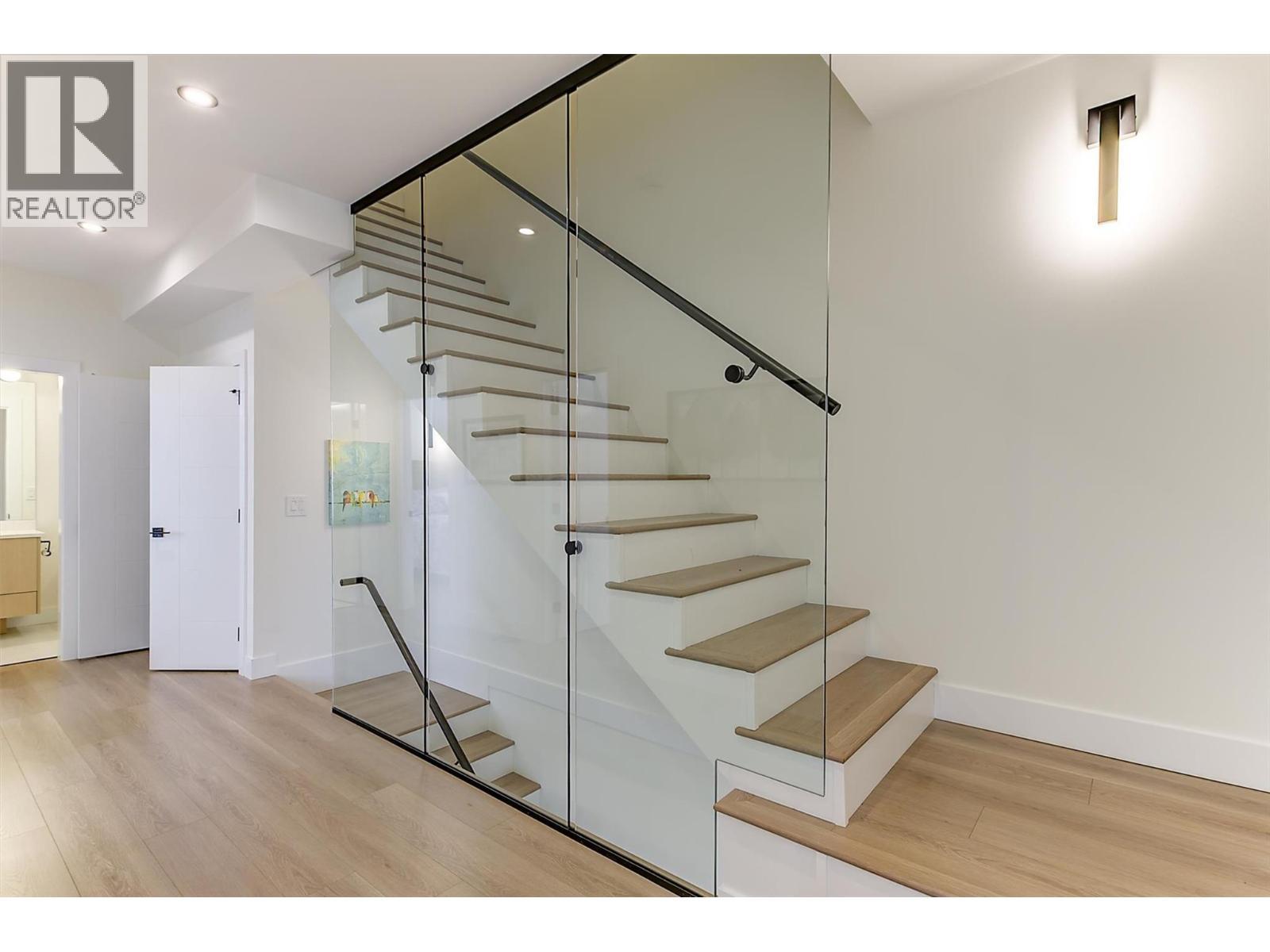 Glass-lined staircase to rooftop level - 747 Patterson Avenue Unit# 2, Kelowna, BC - Indoor Photo Showing Other Room