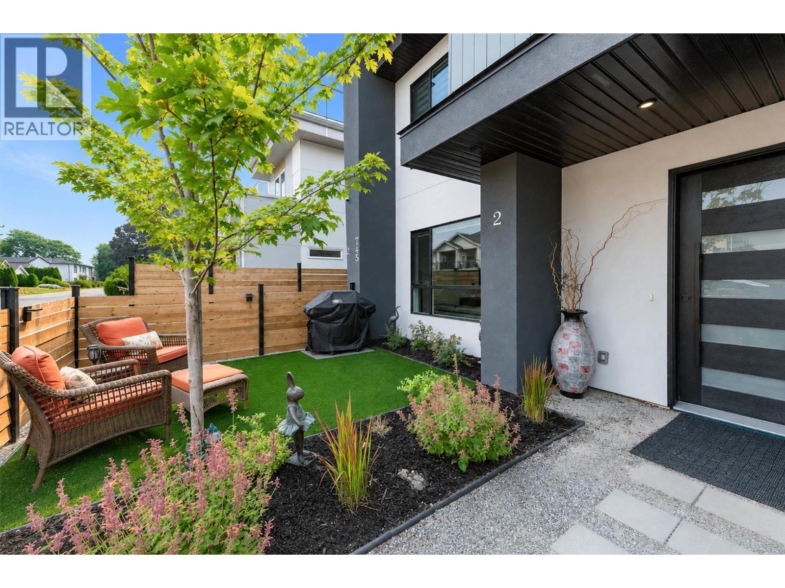 A welcoming walkway leads through the private front yard to your front door - 747 Patterson Avenue Unit# 2, Kelowna, BC - Outdoor With Deck Patio Veranda With Exterior