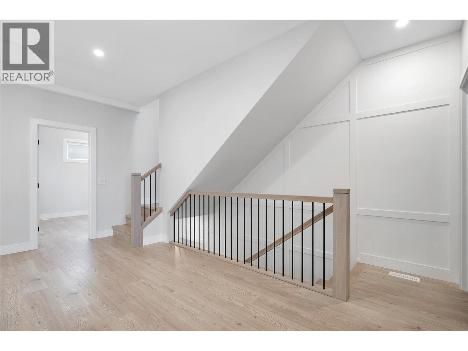 Feature Staircase - 1839 Grey Owl Court, Kelowna, BC - Indoor Photo Showing Other Room