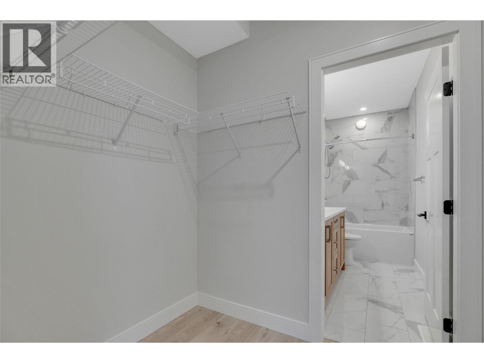 Primary Closet and Bathroom - 1839 Grey Owl Court, Kelowna, BC - Indoor