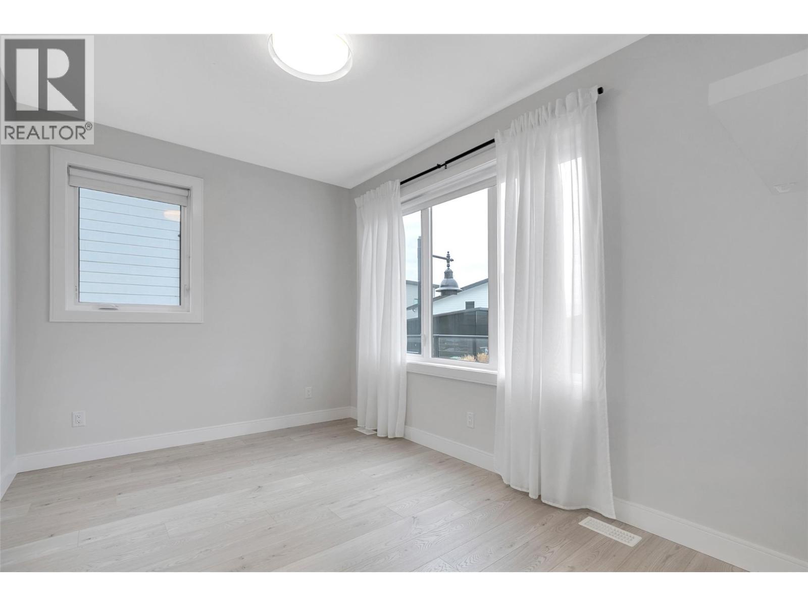 Upstairs Front Bedroom - 1839 Grey Owl Court, Kelowna, BC - Indoor Photo Showing Other Room