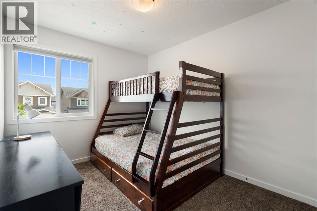 12 Fireside Burrow, Cochrane, AB - Indoor Photo Showing Bedroom