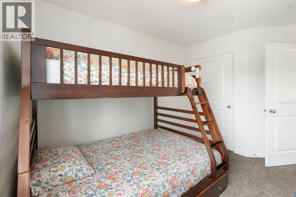 12 Fireside Burrow, Cochrane, AB - Indoor Photo Showing Bedroom