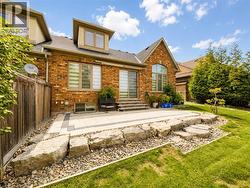 Brick exterior with multiple windows and dormers - 