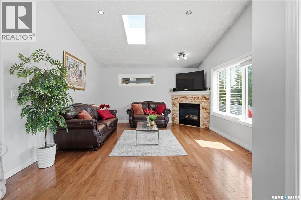 5122 Canuck Crescent, Regina, SK - Indoor Photo Showing Living Room With Fireplace