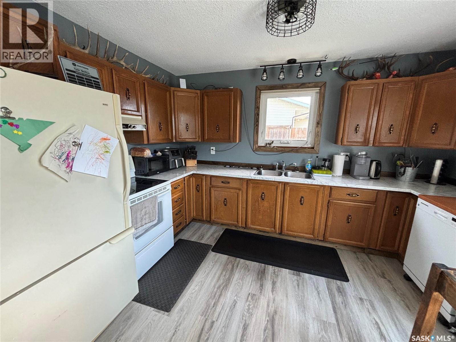 114 Saskatchewan Crescent, Kinistino, SK - Indoor Photo Showing Kitchen With Double Sink