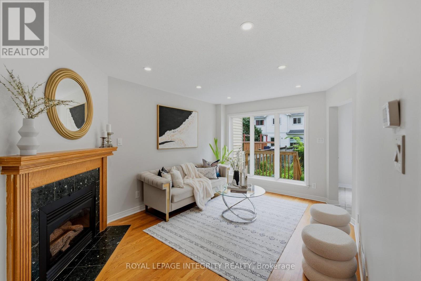 Living Room - Main Level - 20 Redding Way, Ottawa, ON - Indoor Photo Showing Living Room With Fireplace
