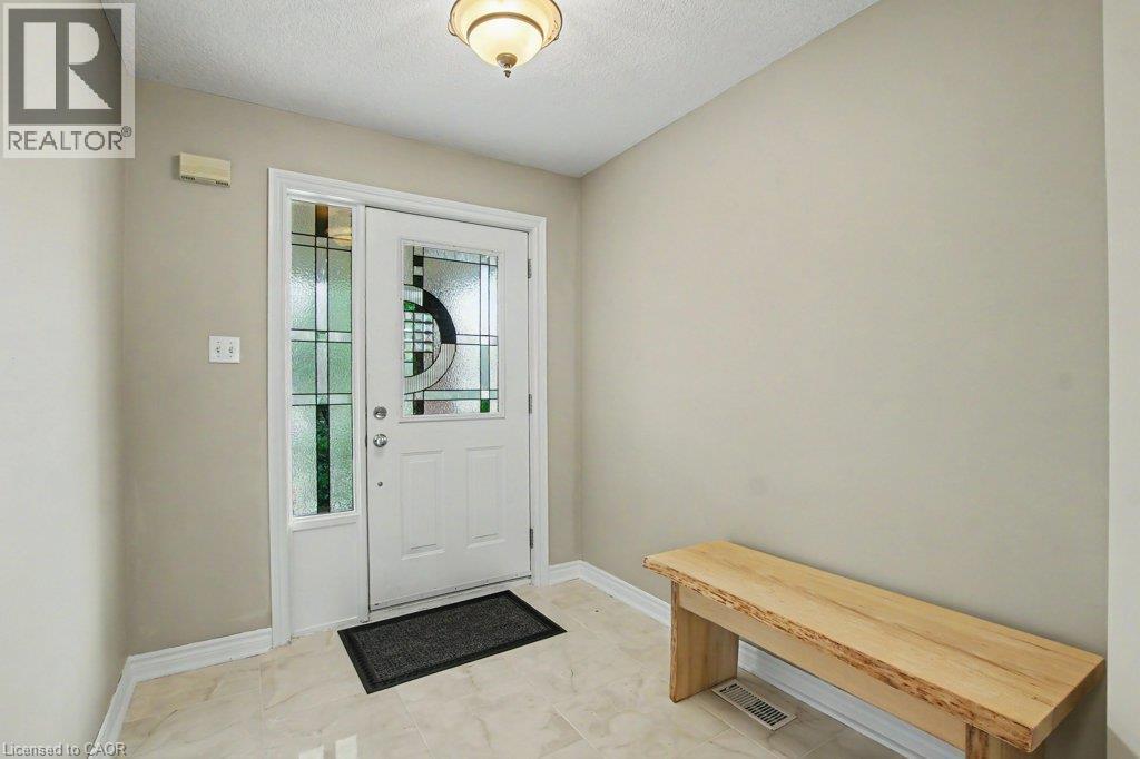 Entryway with decorative glass entry door and tile flooring - 568 Robert Ferrie Drive, Kitchener, ON - Indoor Photo Showing Other Room