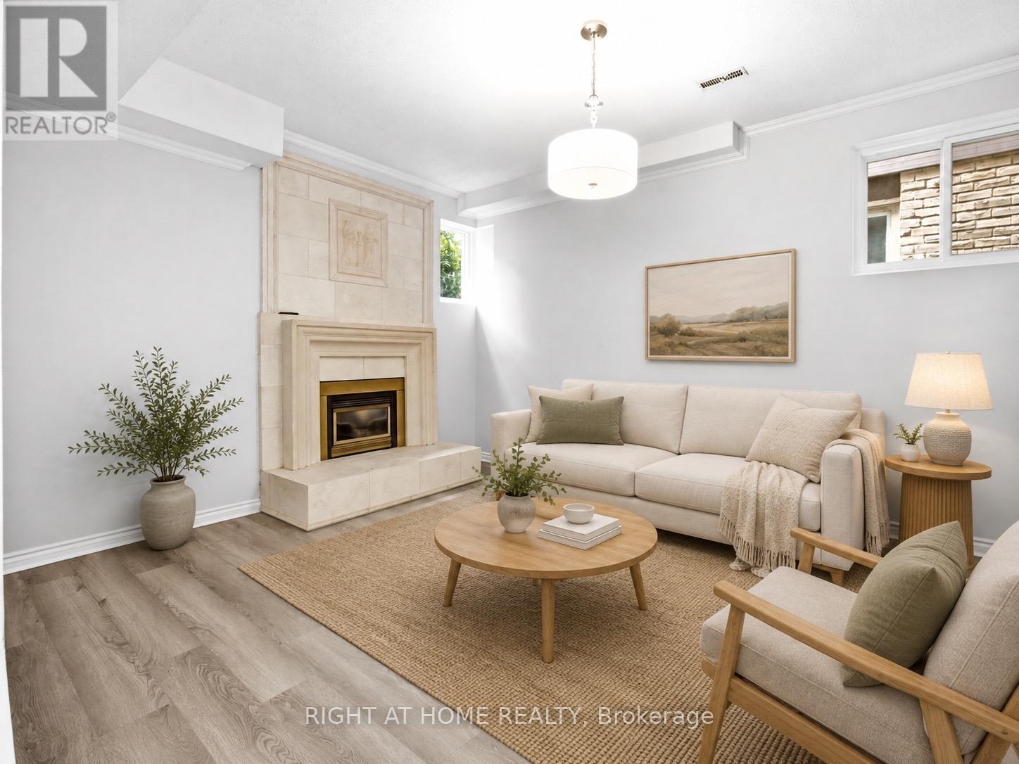 Virtually Staged - In-Law Suite Living Area - 4141 Trellis Crescent, Mississauga, ON - Indoor Photo Showing Living Room With Fireplace