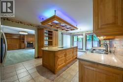 Gourmet Kitchen with Built-In appliances, ceramic tiling, and Marble countertops - 