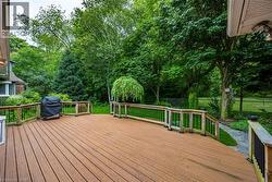 Expansive outdoor deck overlooking very private rear yard - 