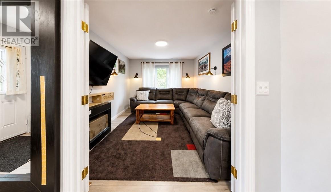 8 Blake, Little Current, ON - Indoor Photo Showing Living Room With Fireplace
