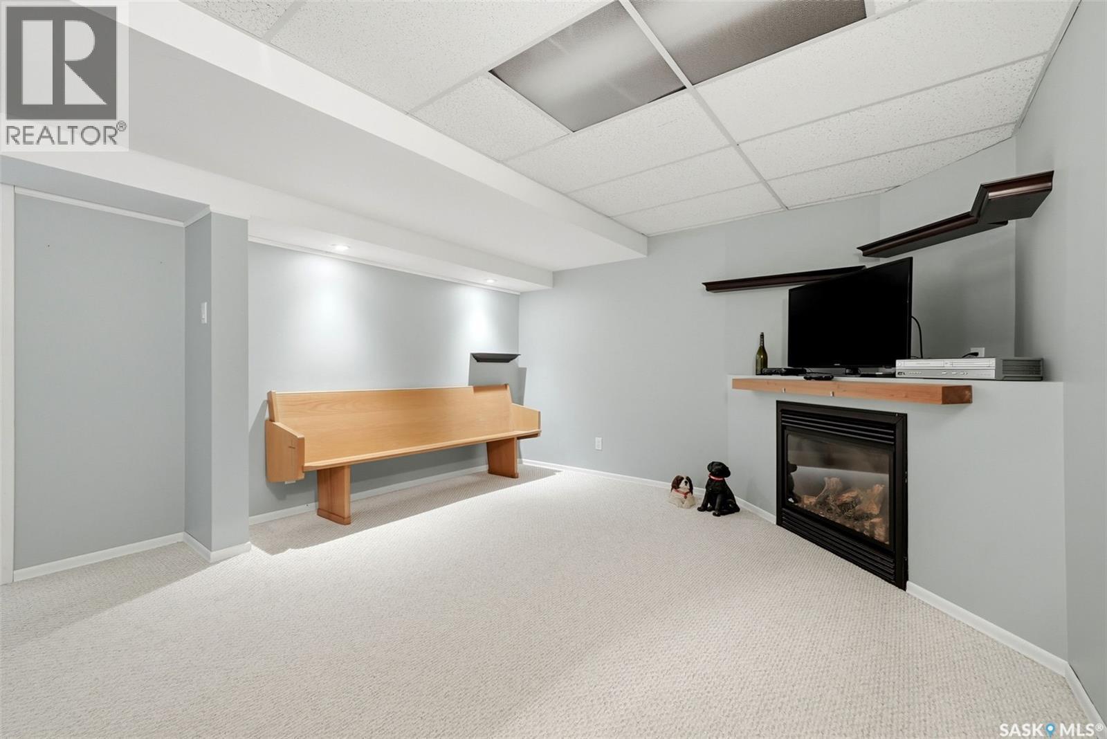 5831 Keffner Bay, Regina, SK - Indoor With Fireplace