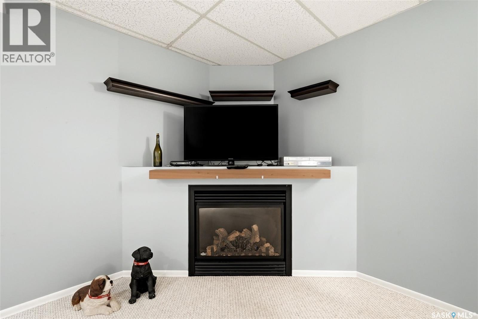 5831 Keffner Bay, Regina, SK - Indoor With Fireplace