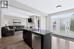 Kitchen island with an undermount sink and stainless steel faucet - 