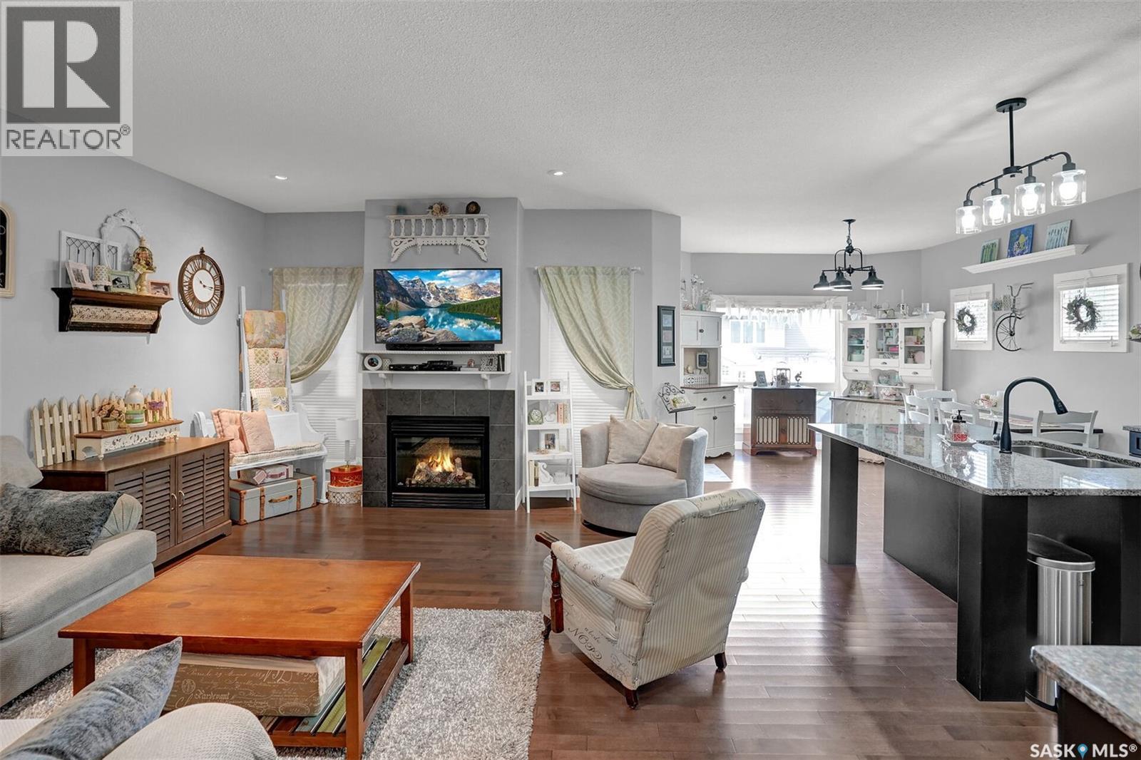 5471 Universal Crescent, Regina, SK - Indoor Photo Showing Living Room With Fireplace