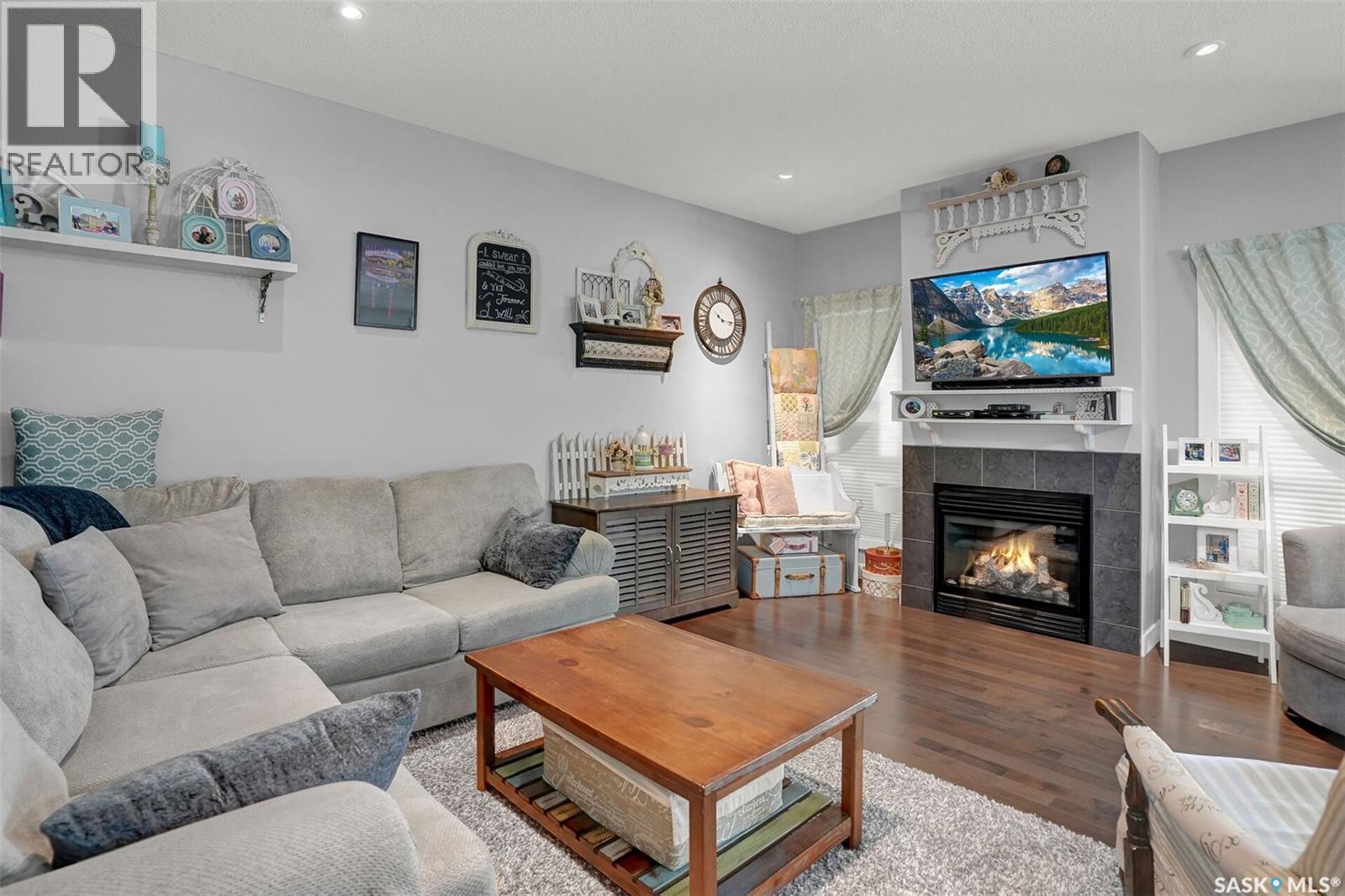 5471 Universal Crescent, Regina, SK - Indoor Photo Showing Living Room With Fireplace