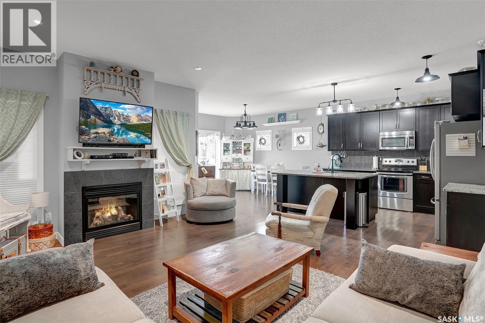 5471 Universal Crescent, Regina, SK - Indoor Photo Showing Living Room With Fireplace