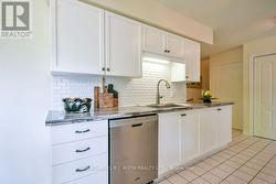 Modern Kitchen w/Tiled Backsplash - 
