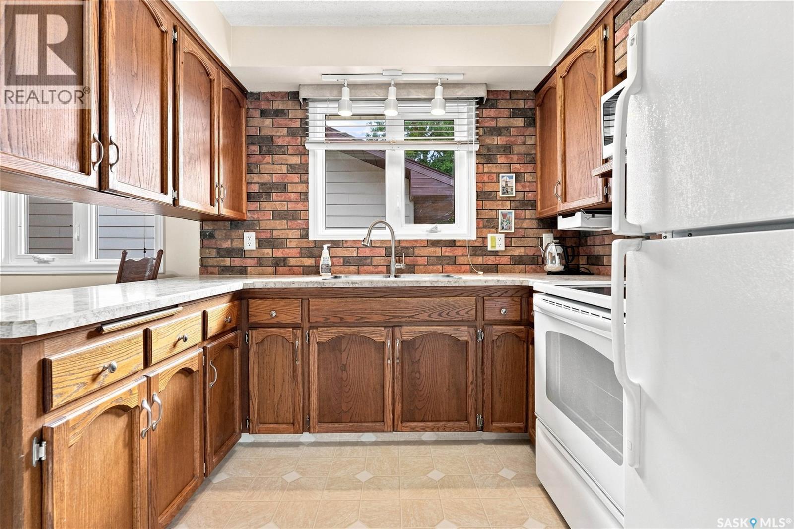 220 Frontenac Drive, Regina, SK - Indoor Photo Showing Kitchen With Double Sink