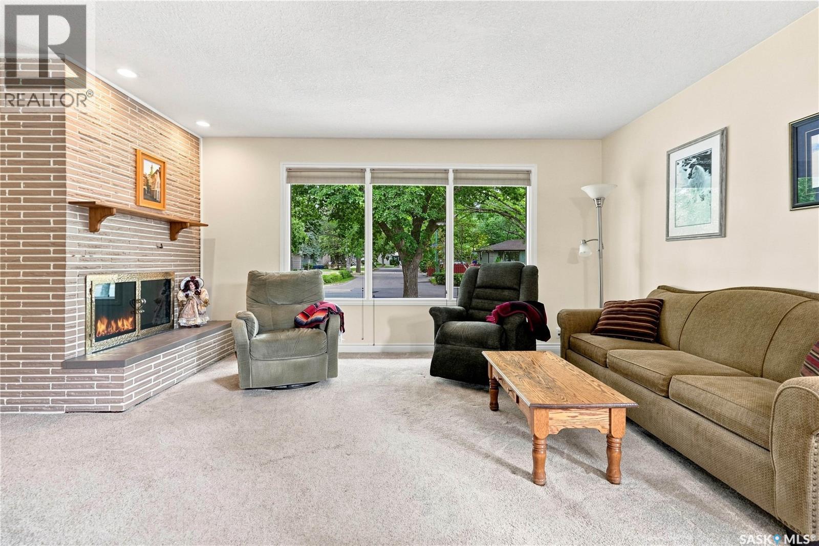 220 Frontenac Drive, Regina, SK - Indoor Photo Showing Living Room With Fireplace