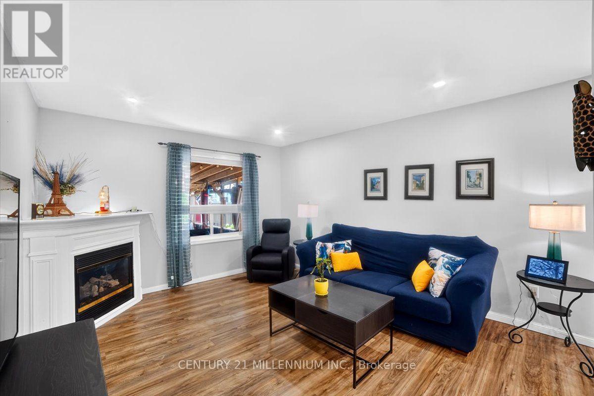 23 Eldad Drive, Clarington, ON - Indoor Photo Showing Living Room With Fireplace