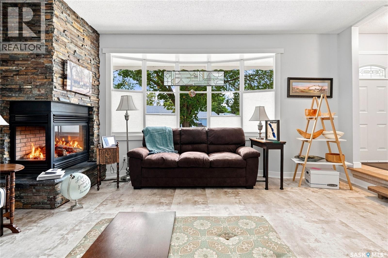 2 Springstein Avenue, Regina, SK - Indoor Photo Showing Living Room With Fireplace