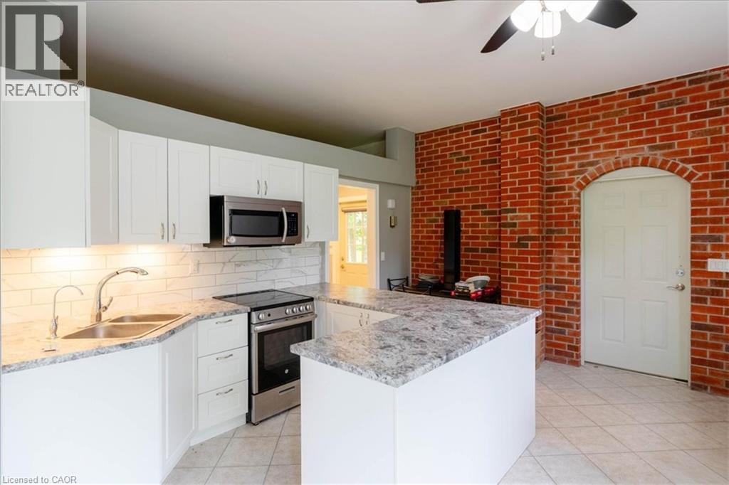 111 Decou Road, Simcoe, ON - Indoor Photo Showing Kitchen With Double Sink With Upgraded Kitchen