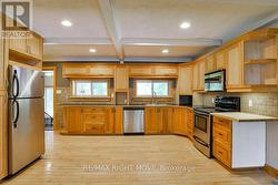 Spacious eat-in kitchen; hardwood floor. - 