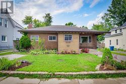 Tasteful gardens on the front lawn. - 
