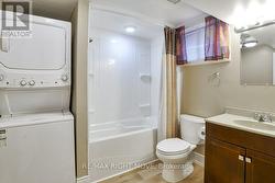 Modern 4pc. bath in basement; laundry facilities. - 