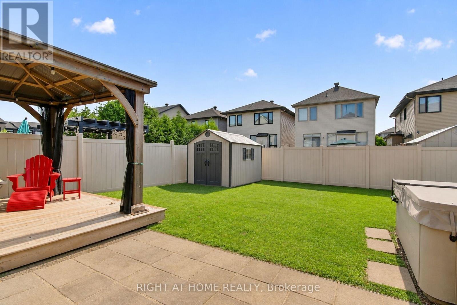 Garden removed by photo enhancement - 207 Mareth Way, Ottawa, ON - Outdoor With Backyard