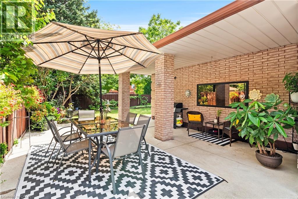 Covered patio with brick columns and a brick wall - 87 Monte Drive, Hamilton, ON - Outdoor With Deck Patio Veranda