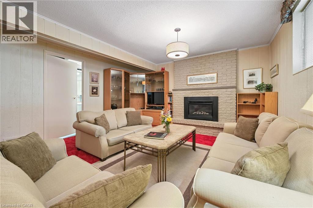 30 Shuh Avenue, Kitchener, ON - Indoor Photo Showing Living Room With Fireplace