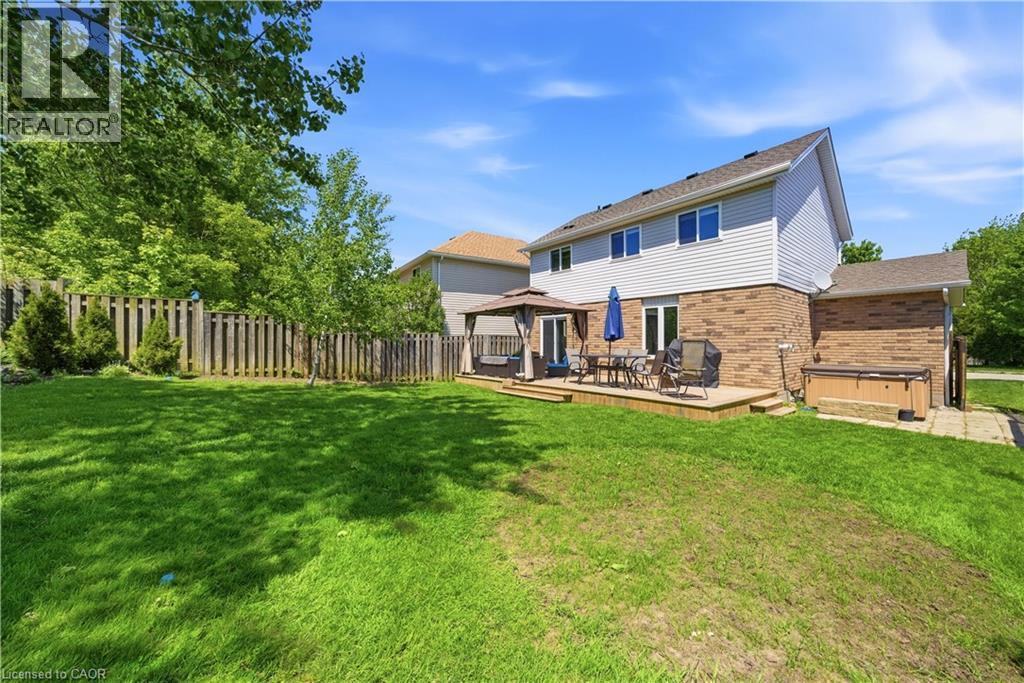 Expansive backyard with a large wooden deck featuring a gazebo - 784 Butternut Avenue, Waterloo, ON - Outdoor With Deck Patio Veranda