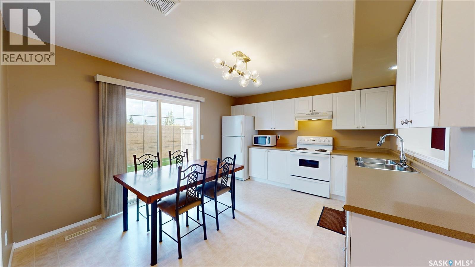 13 809 Kristjanson Road, Saskatoon, SK - Indoor Photo Showing Kitchen With Double Sink