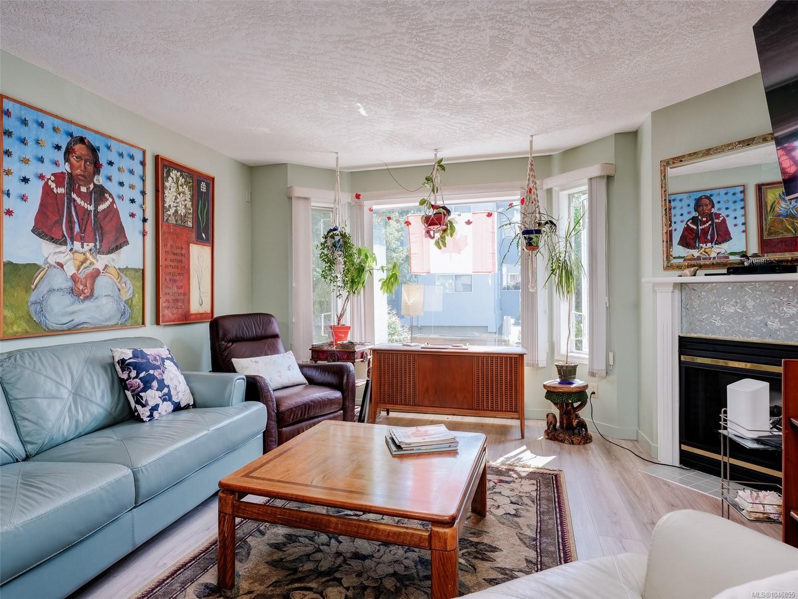 #208-9882 Fifth St, Sidney, BC - Indoor Photo Showing Living Room With Fireplace