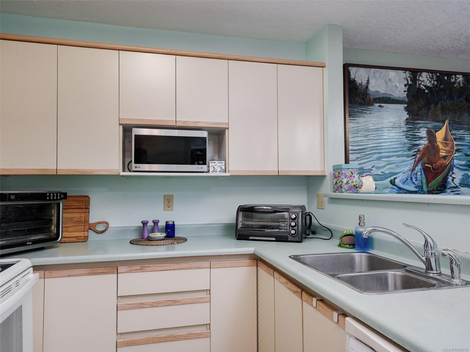#208-9882 Fifth St, Sidney, BC - Indoor Photo Showing Kitchen With Double Sink