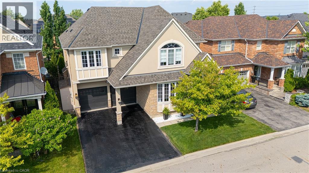 Two-story residence featuring a combination of brick and stucco siding - 1406 Marshall Crescent, Milton, ON - Outdoor