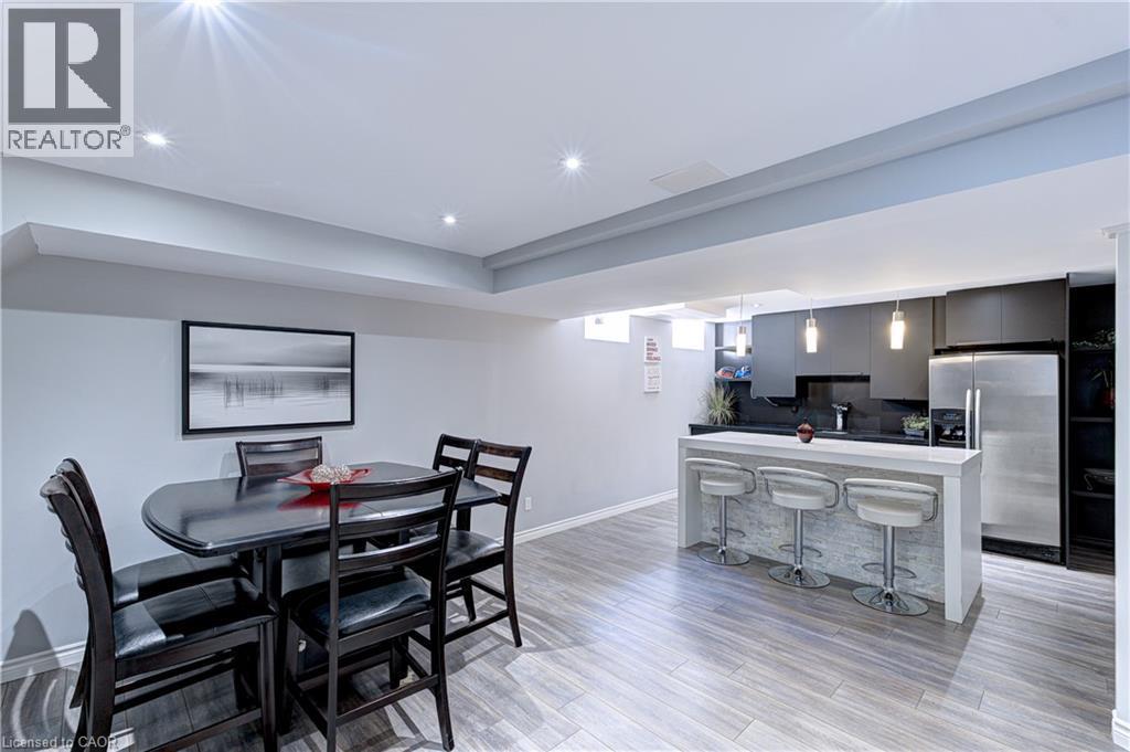 Open-concept living space with recessed lighting and wood-finish flooring - 1406 Marshall Crescent, Milton, ON - Indoor Photo Showing Dining Room