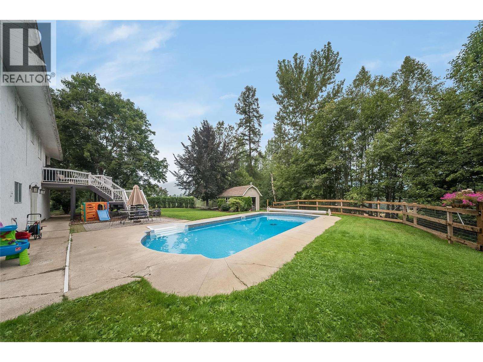 314 Webster Road, Fruitvale, BC - Outdoor With In Ground Pool With Backyard
