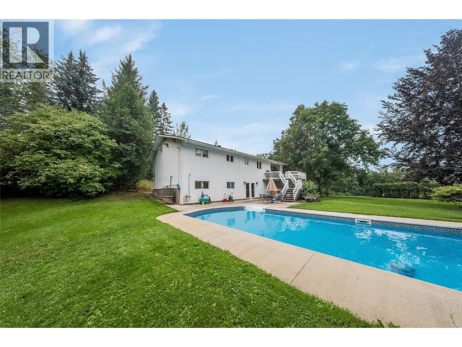314 Webster Road, Fruitvale, BC - Outdoor With In Ground Pool With Backyard