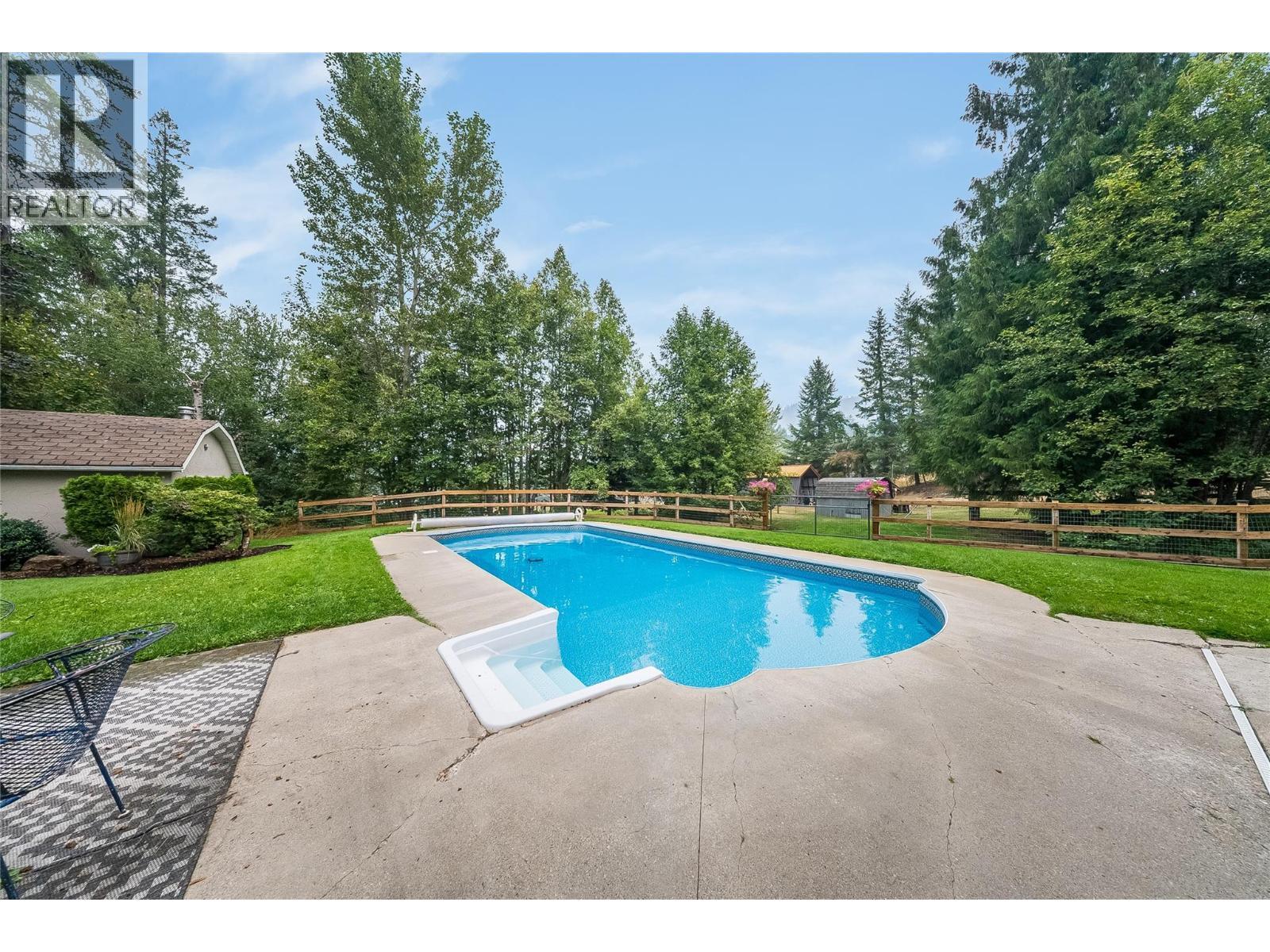 314 Webster Road, Fruitvale, BC - Outdoor With In Ground Pool With Backyard